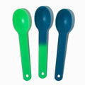 Close-up of assorted plastic tasting spoons stacked and ready to serve
