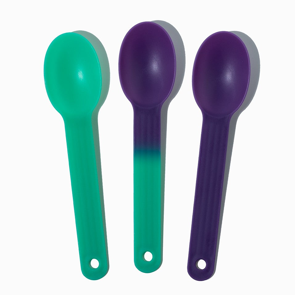 Close-up of assorted tasting spoons stacked and ready to serve