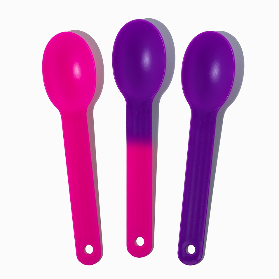 Close-up of assorted tasting spoons stacked and ready to serve