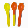 Close-up of assorted tasting spoons stacked and ready to serve