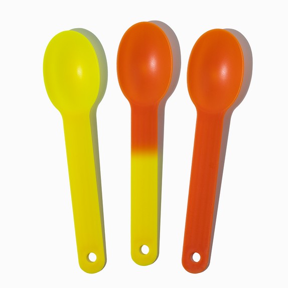 Close-up of assorted tasting spoons stacked and ready to serve