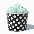 Close-up of 12 oz black ice cream cups stacked and ready to serve
