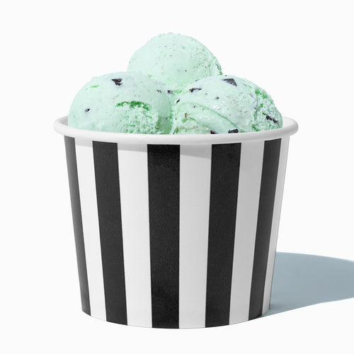 Close-up of 12 oz black ice cream cups stacked and ready to serve