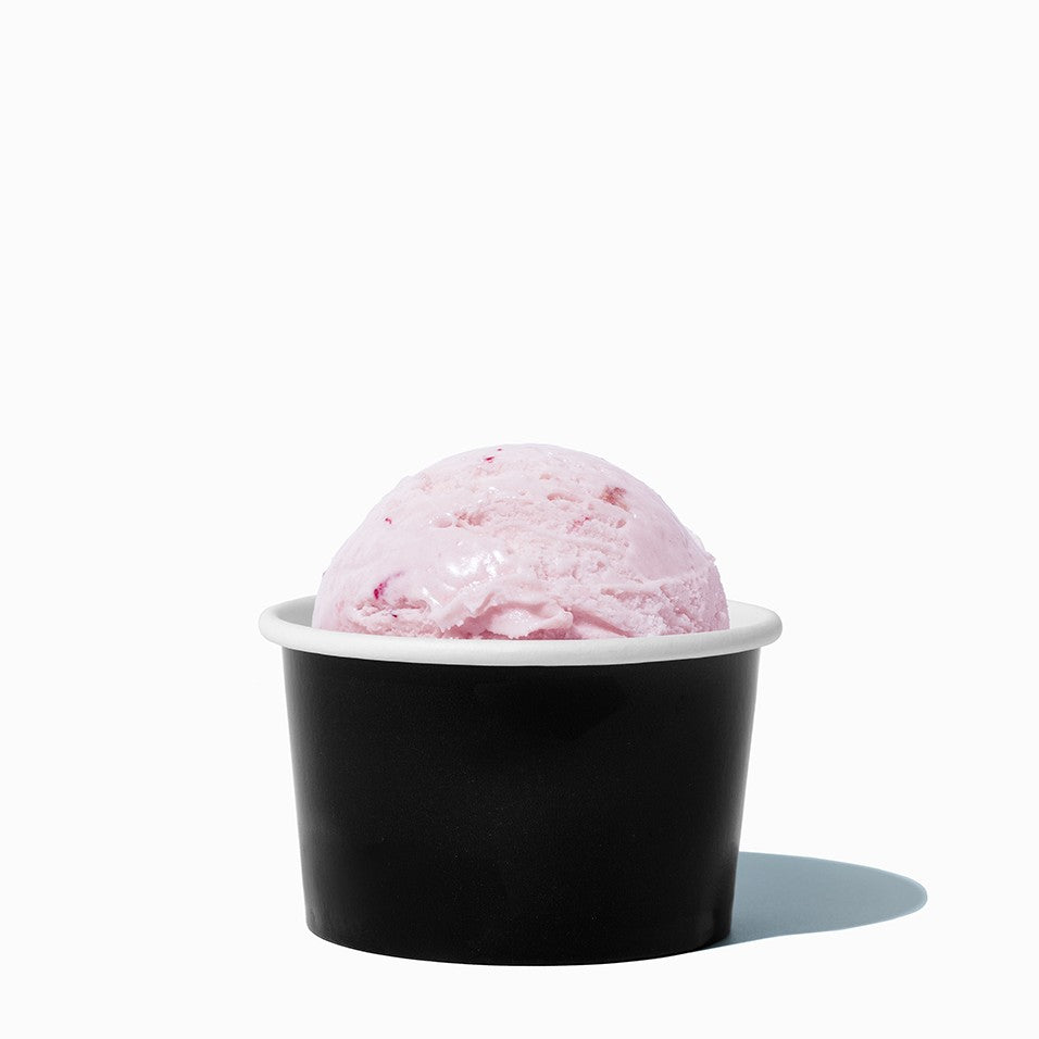 Close-up of 4 oz black paper ice cream cups stacked and ready to serve