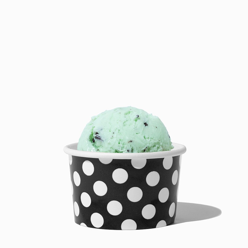 Close-up of 4 oz black ice cream cups stacked and ready to serve