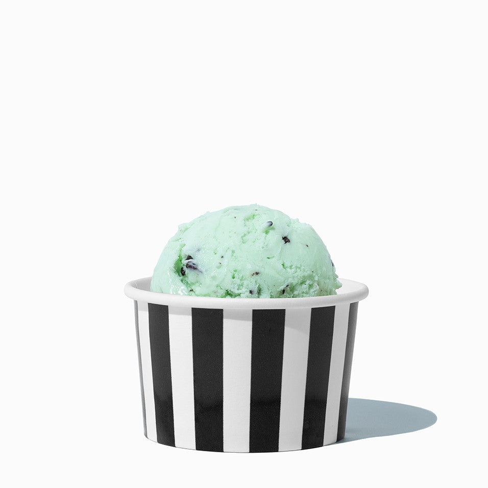 Close-up of 4 oz black ice cream cups stacked and ready to serve