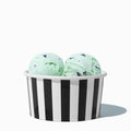 Close-up of 6 oz black ice cream cups stacked and ready to serve
