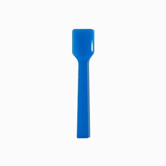 Close-up of blue tasting spoons stacked and ready to serve