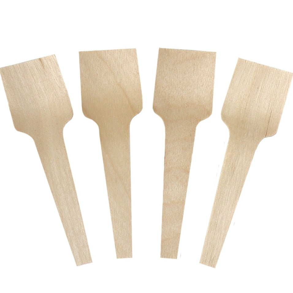 Close-up of compostable tasting spoons stacked and ready to serve
