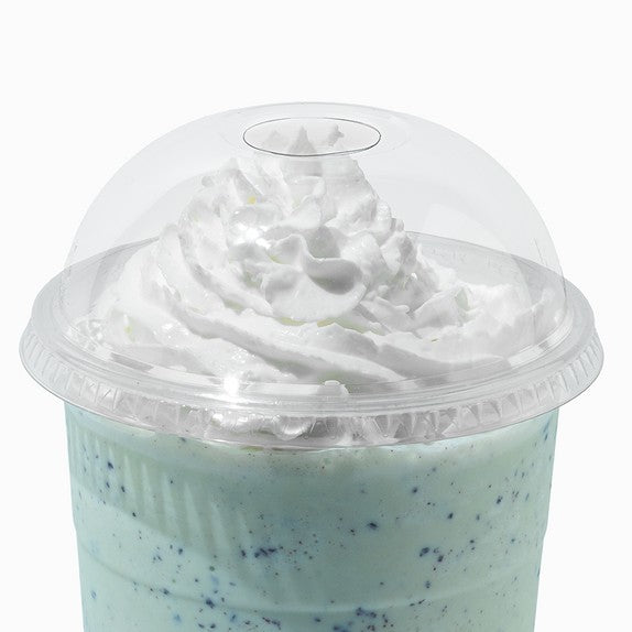 Close-up of 1 Quart clear plastic cup lids stacked and ready to serve