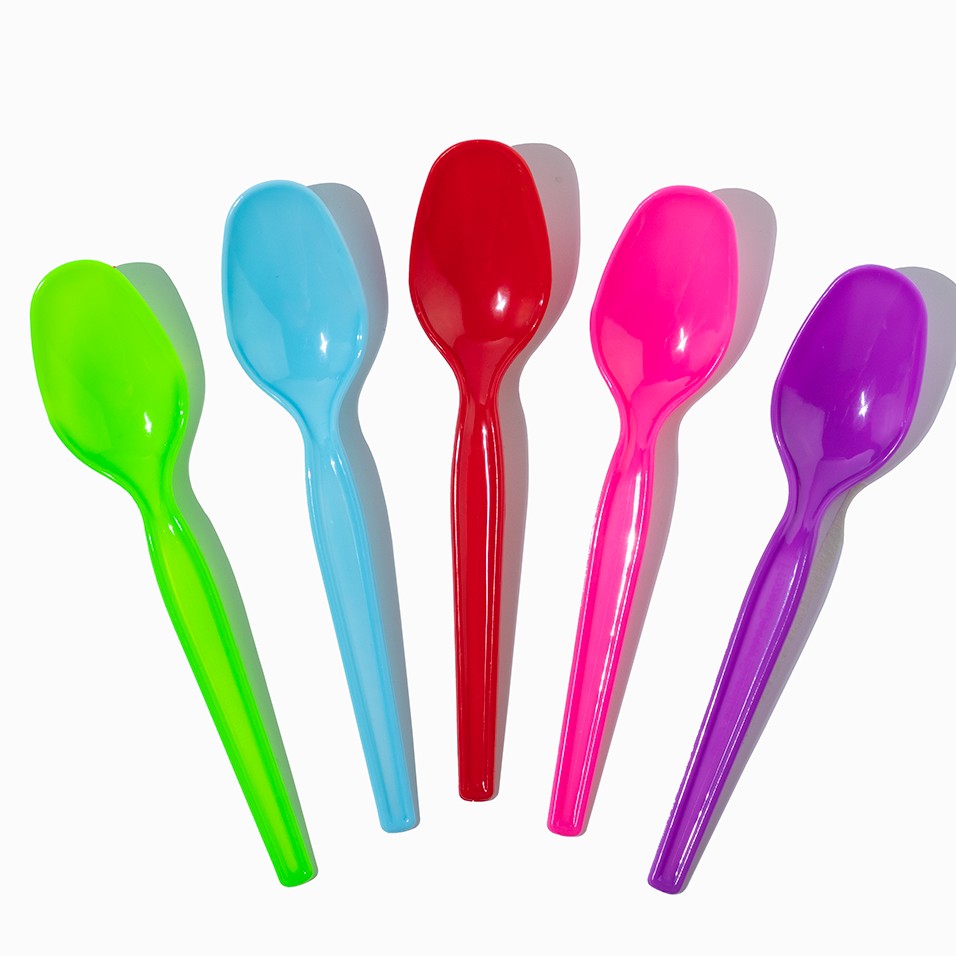 Close-up of assorted tasting spoons stacked and ready to serve