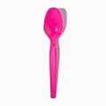 Close-up of pink plastic tasting spoons stacked and ready to serve