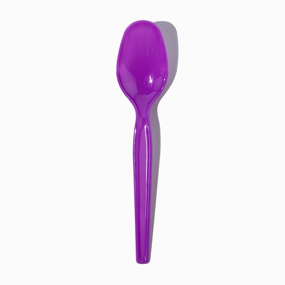 Close-up of purple tasting spoons stacked and ready to serve
