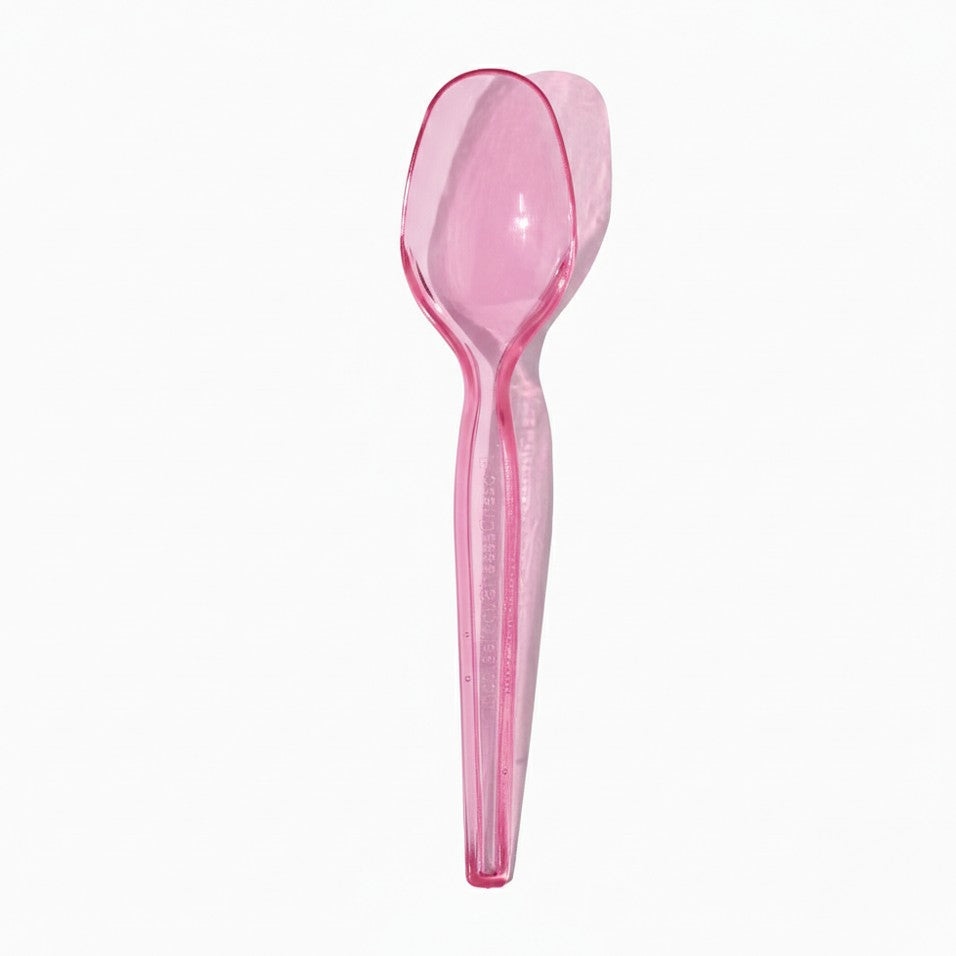 Close-up of clear tasting spoons stacked and ready to serve