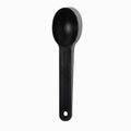 Close-up of black tasting spoons stacked and ready to serve