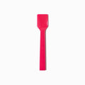Close-up of pink tasting spoons stacked and ready to serve