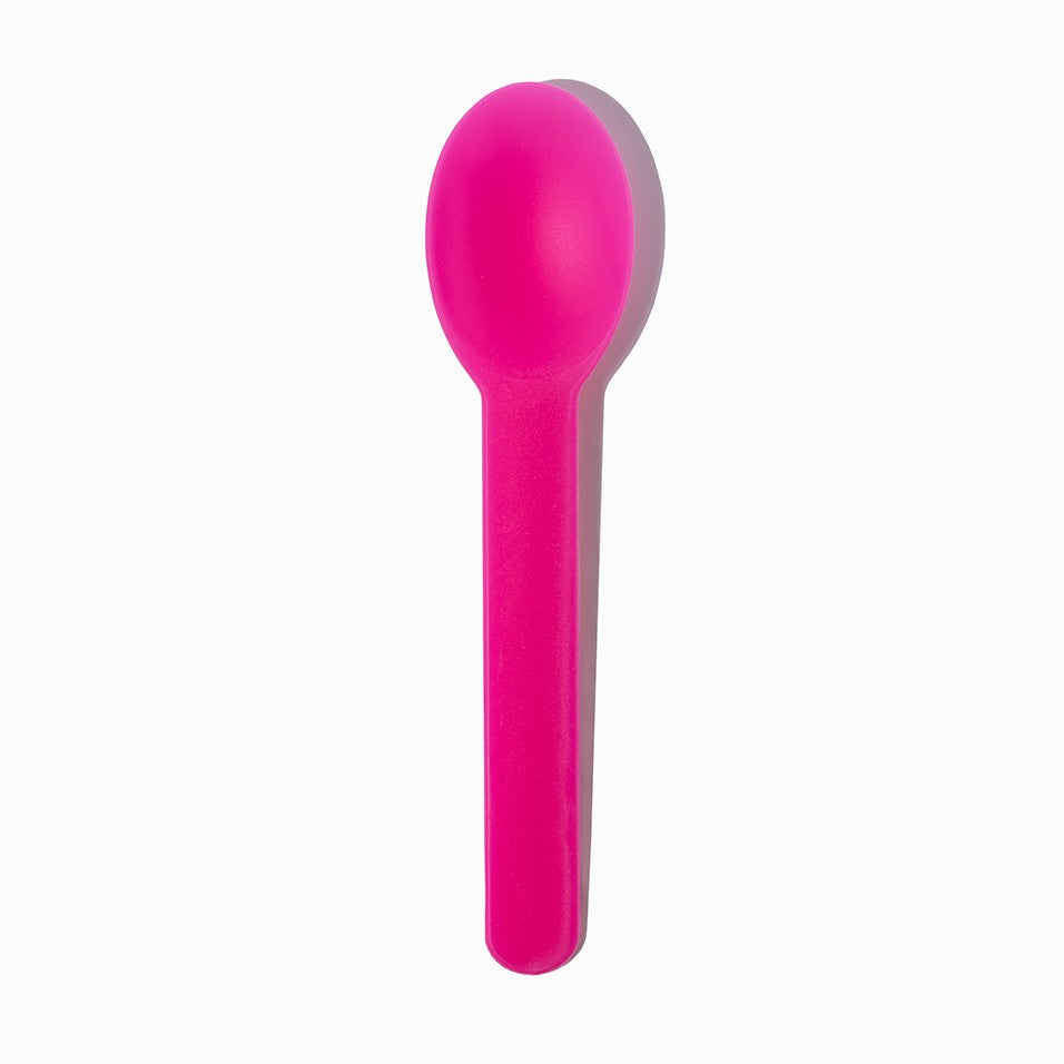 Close-up of pink tasting spoons stacked and ready to serve