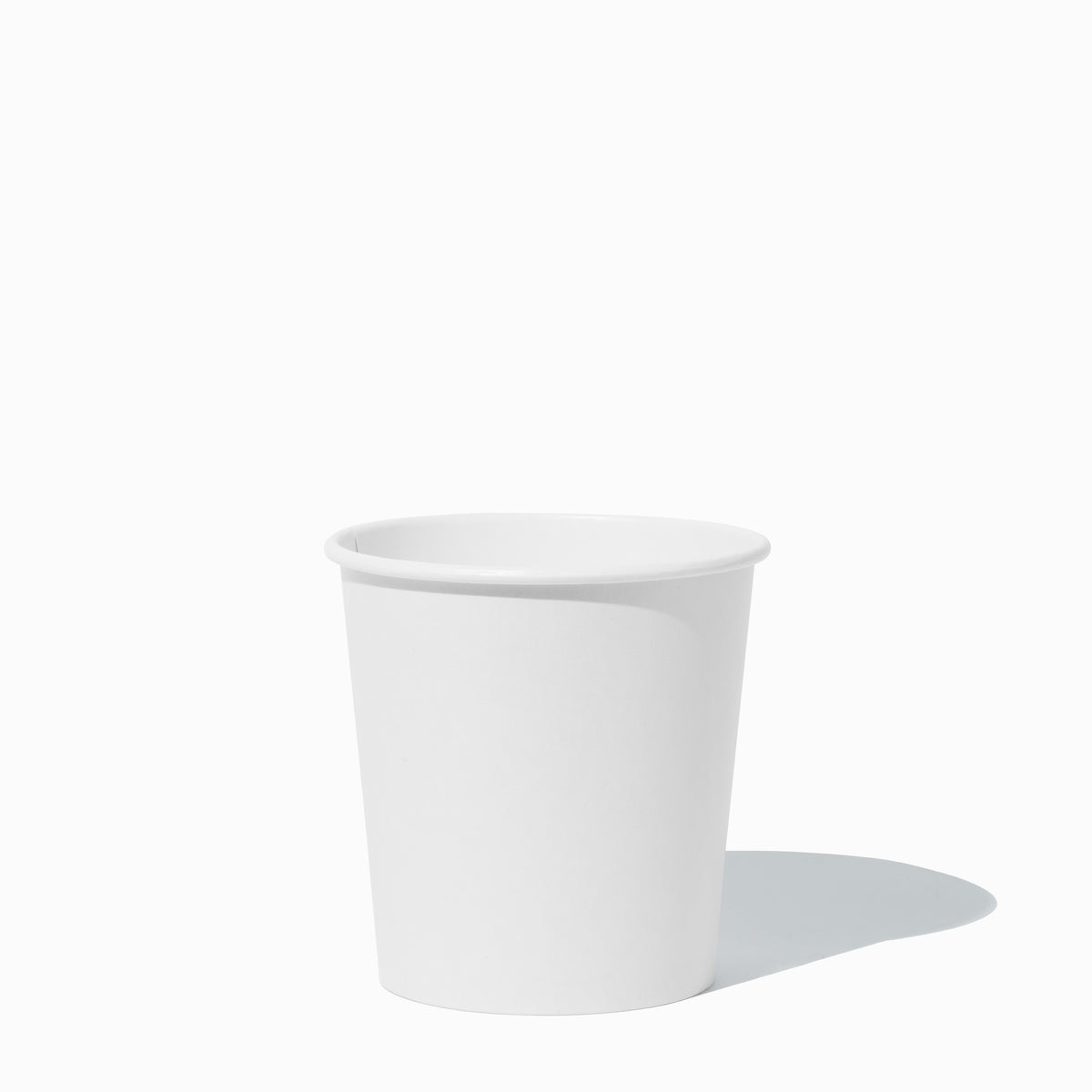 Close-up of 1 Pint white compostable to-go containers stacked and ready to serve