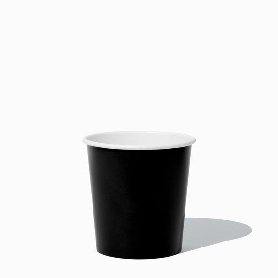 Close-up of 1 Pint black paper to-go containers stacked and ready to serve