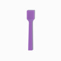 Close-up of purple tasting spoons stacked and ready to serve