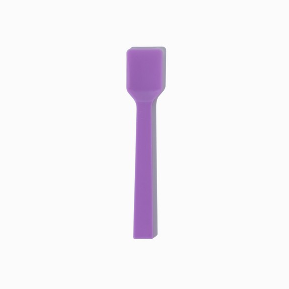 Close-up of purple tasting spoons stacked and ready to serve