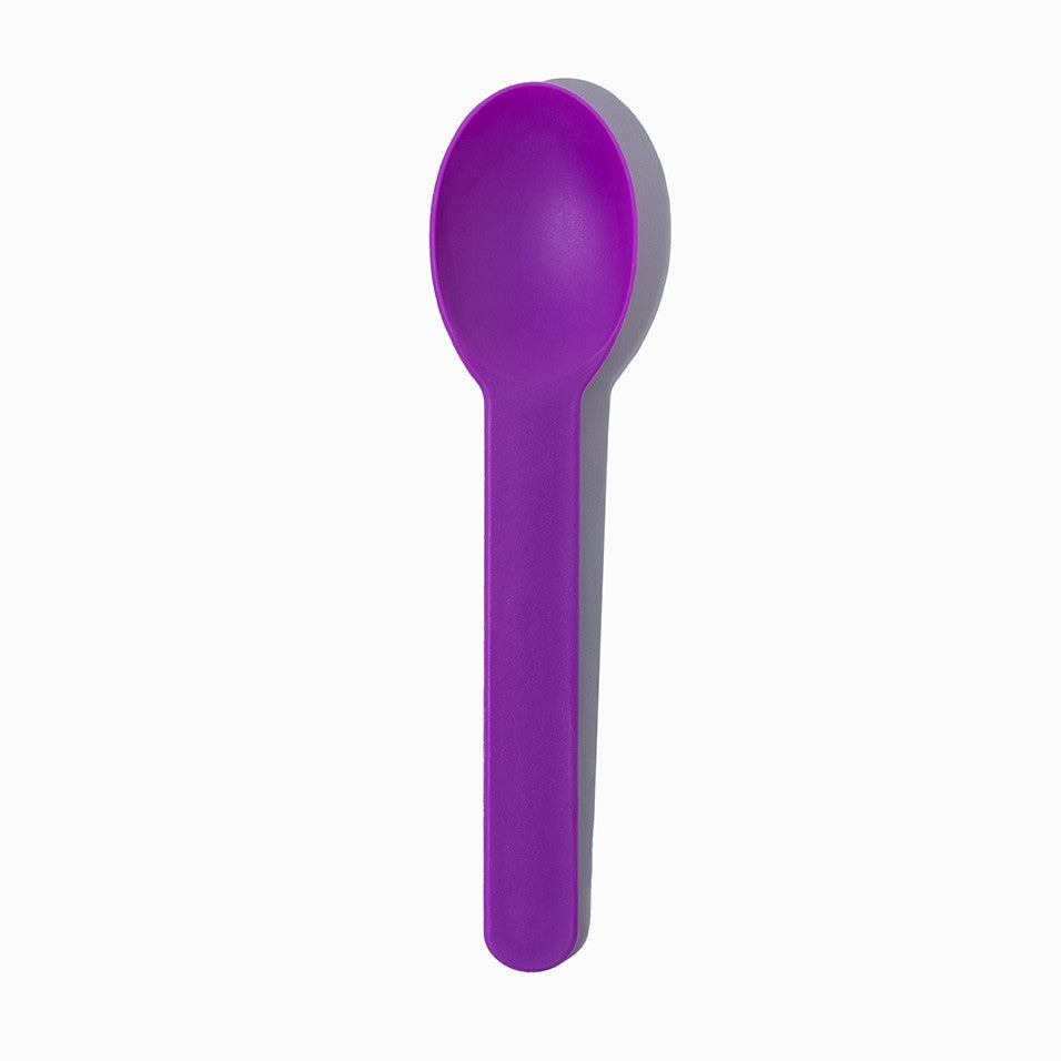 Close-up of purple tasting spoons stacked and ready to serve