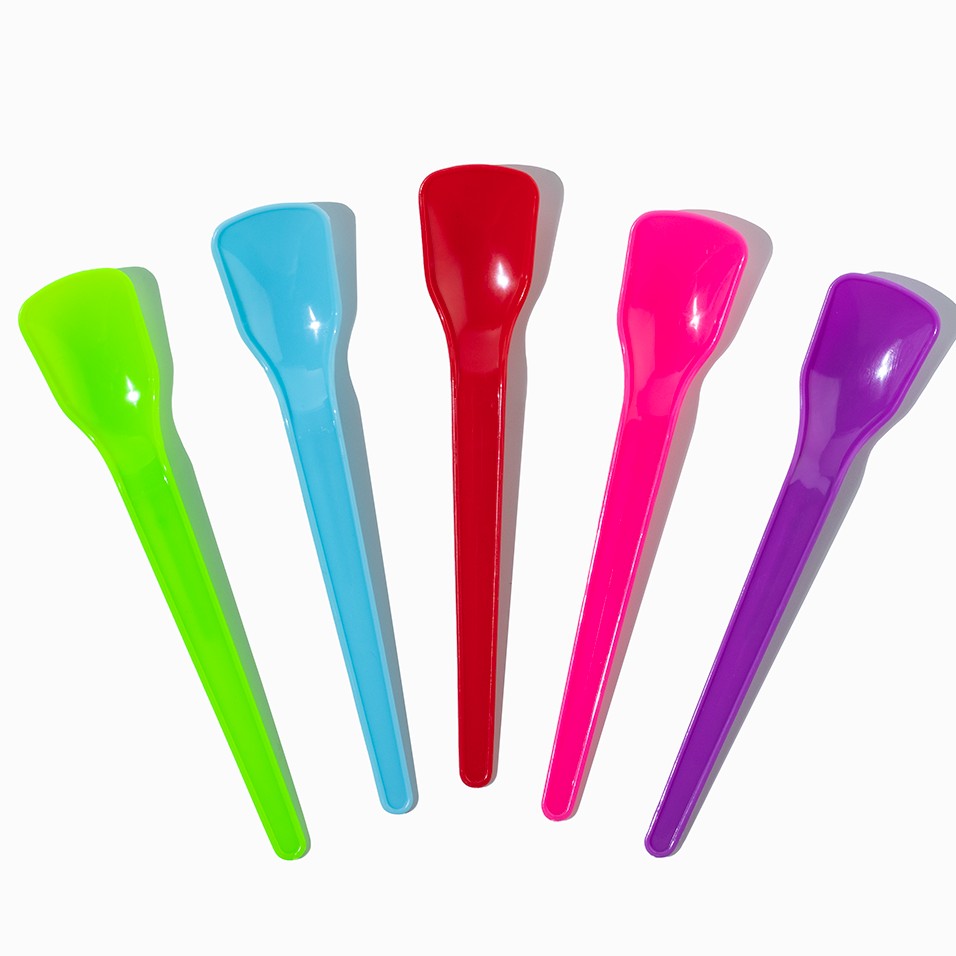 Close-up of assorted tasting spoons stacked and ready to serve