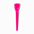 Close-up of pink tasting spoons stacked and ready to serve