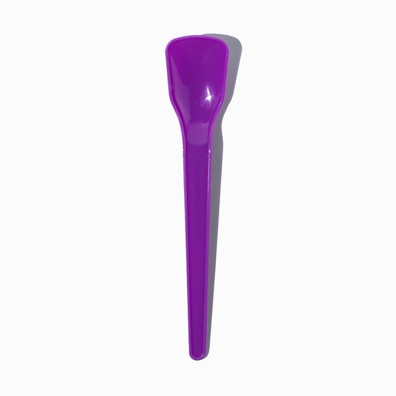 Close-up of purple tasting spoons stacked and ready to serve