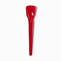 Close-up of red tasting spoons stacked and ready to serve
