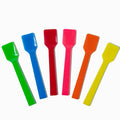Close-up of assorted tasting spoons stacked and ready to serve