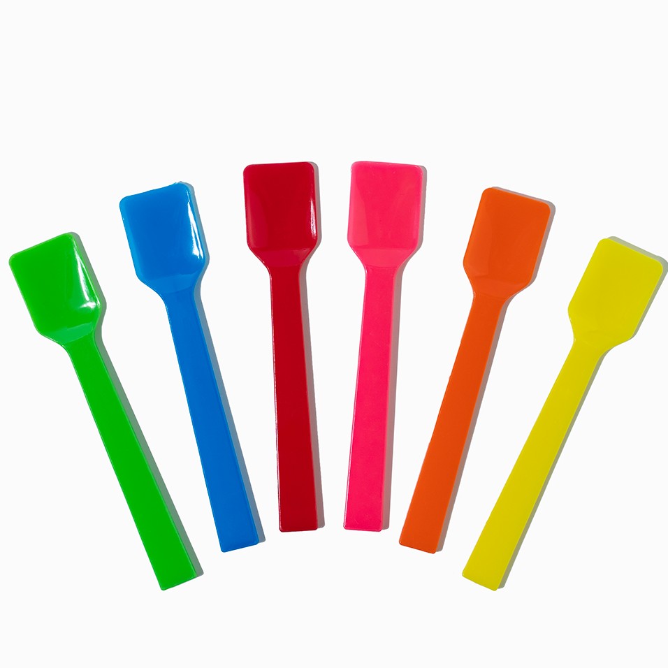Close-up of assorted tasting spoons stacked and ready to serve