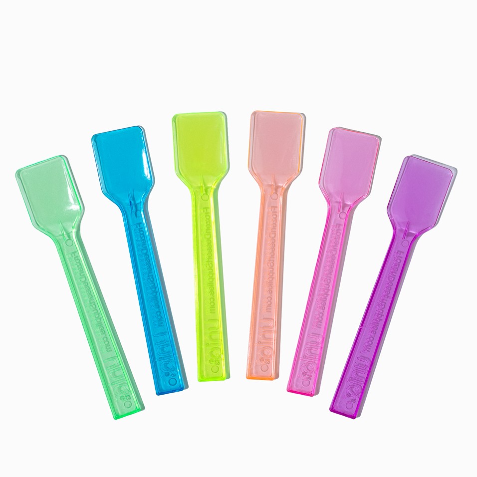 Close-up of assorted tasting spoons stacked and ready to serve