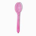 Close-up of pink tasting spoons stacked and ready to serve