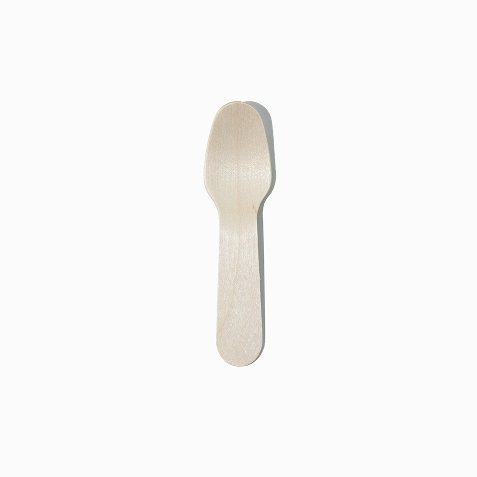 Close-up of compostable tasting spoons stacked and ready to serve